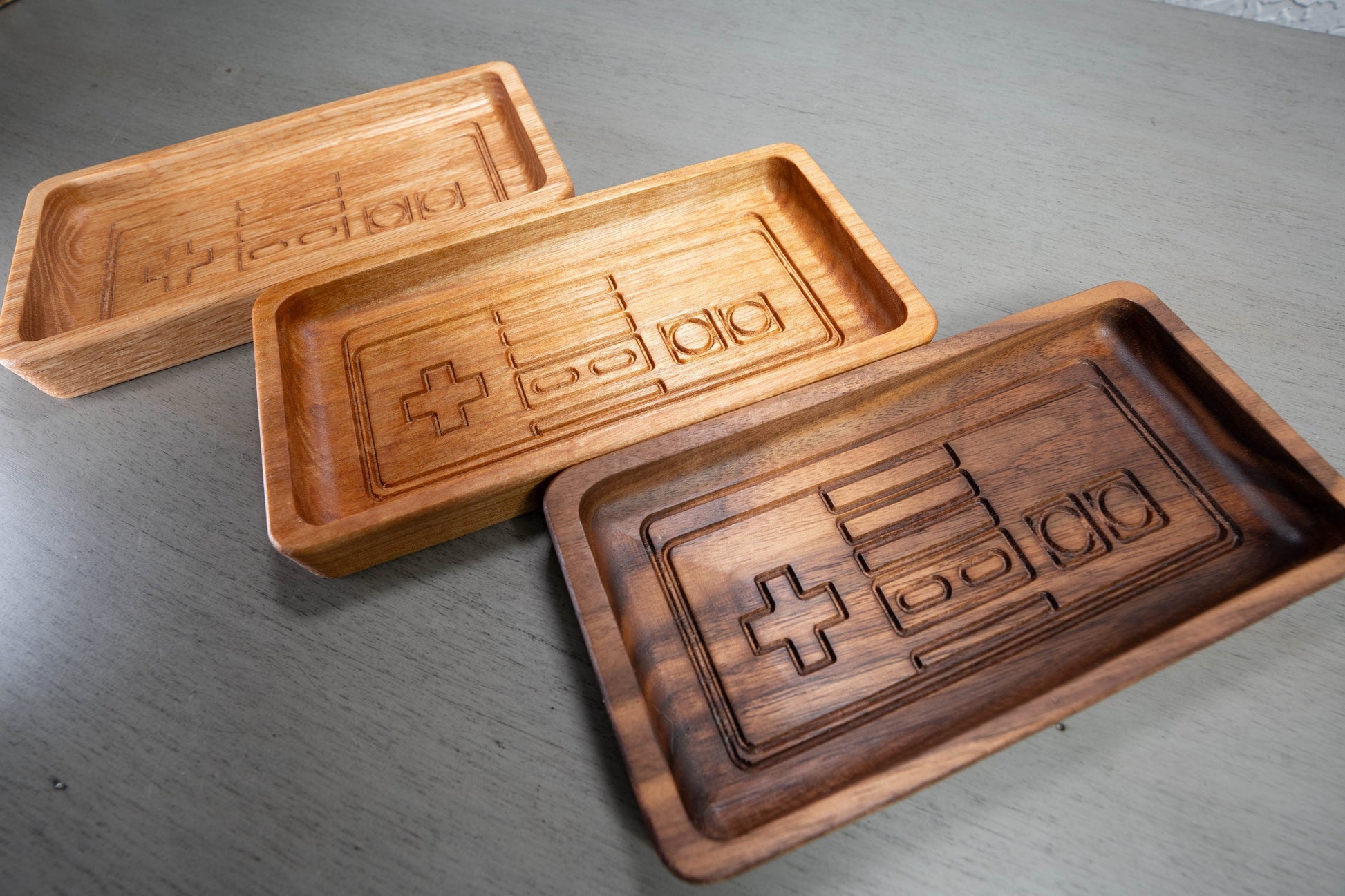 All 3 variants of Glasses Tray, Oak on the left, Birch in the middle, and Walnut on the right.